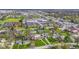 Neighborhood aerial view of homes surrounded by lush trees and greenery at 32 W Michigan St, Greenfield, IN 46140