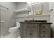 Bathroom featuring grey vanity, toilet, and storage shelf at 32 W Michigan St, Greenfield, IN 46140