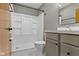 Bathroom featuring white tiled shower, and gray vanity at 32 W Michigan St, Greenfield, IN 46140