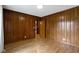 Bedroom features wood paneling and hardwood floors with a closet at 32 W Michigan St, Greenfield, IN 46140