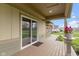 Covered patio with sliding glass door access and outdoor seating, perfect for enjoying the backyard and relaxing outdoors at 32 W Michigan St, Greenfield, IN 46140