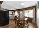The dining area includes a wooden table and chair set with access to the kitchen and views of the exterior at 32 W Michigan St, Greenfield, IN 46140