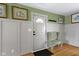 Inviting entryway with hardwood floors, neutral wall color, and decorative moldings, creating a warm and welcoming ambiance at 32 W Michigan St, Greenfield, IN 46140