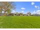 A sprawling lush green lawn with a charming single story home and stone walkway, adding to its curb appeal at 32 W Michigan St, Greenfield, IN 46140