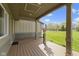 Spacious covered porch with plenty of room for outdoor seating, ideal for relaxing and enjoying the neighborhood views at 32 W Michigan St, Greenfield, IN 46140