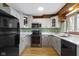A well-equipped kitchen boasts stainless steel appliances, and sleek countertops for a modern cooking space at 32 W Michigan St, Greenfield, IN 46140