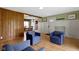 Spacious living room with hardwood floors, natural wood accents and direct access to dining area offering seamless living at 32 W Michigan St, Greenfield, IN 46140