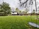 Expansive backyard with lush green lawn and mature trees at 337 Leaning Tree Rd, Greenwood, IN 46142