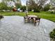 Relaxing patio area with outdoor seating, perfect for enjoying the serene backyard view at 337 Leaning Tree Rd, Greenwood, IN 46142