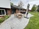 Outdoor patio with dining set adjacent to home at 337 Leaning Tree Rd, Greenwood, IN 46142