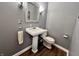 Classic half-bathroom with pedestal sink, ornate mirror, and attractive light fixtures at 337 Leaning Tree Rd, Greenwood, IN 46142