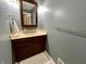 Powder room boasts a cherry vanity, neutral countertop, and a large mirror at 337 Leaning Tree Rd, Greenwood, IN 46142