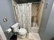 Bathroom with a toilet and a shower-tub combination at 337 Leaning Tree Rd, Greenwood, IN 46142