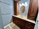 Bathroom featuring spacious vanity with drawers, wood cabinets, modern lighting, and a decorative mirror at 337 Leaning Tree Rd, Greenwood, IN 46142