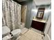 Bathroom with a cherry vanity and a shower-tub combination at 337 Leaning Tree Rd, Greenwood, IN 46142
