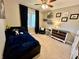 Bedroom featuring a cozy bed, carpeted floors, dresser, and personal decorations creating a comfortable and inviting space at 337 Leaning Tree Rd, Greenwood, IN 46142
