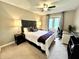 Cozy bedroom with carpet, ceiling fan, and accent pillows on bed and a work station at 337 Leaning Tree Rd, Greenwood, IN 46142
