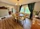 This formal dining room has a wood dining table, seating for six, and a decorative light fixture at 337 Leaning Tree Rd, Greenwood, IN 46142