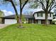 Charming two-story home with brick and siding, nestled among mature trees at 337 Leaning Tree Rd, Greenwood, IN 46142