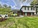 Charming two-story home with a well-manicured lawn and mature trees provides great curb appeal at 337 Leaning Tree Rd, Greenwood, IN 46142
