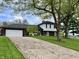 Lovely two-story home featuring a well-kept lawn, a paved driveway and an attached two car garage at 337 Leaning Tree Rd, Greenwood, IN 46142