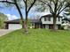 Charming two-story home with a well-manicured lawn and mature trees provides great curb appeal at 337 Leaning Tree Rd, Greenwood, IN 46142