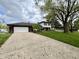 Charming two-story home with a well-manicured lawn, paved driveway and two car attached garage at 337 Leaning Tree Rd, Greenwood, IN 46142