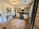 Bright office with custom built-ins, modern desk, hardwood floors, and oversized windows, providing ample natural light at 337 Leaning Tree Rd, Greenwood, IN 46142