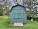 Green shed in the backyard of a well-maintained property at 337 Leaning Tree Rd, Greenwood, IN 46142
