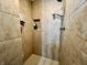 Tiled standing shower featuring a shower head, a niche for storage, and neutral tones that offer a relaxing retreat at 337 Leaning Tree Rd, Greenwood, IN 46142