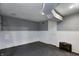 Spacious basement area with painted block and paneling, plus utility access door at 3549 N Sherman Dr, Indianapolis, IN 46218