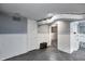 Open basement with utility access, painted paneling, and bright lighting at 3549 N Sherman Dr, Indianapolis, IN 46218