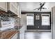 Kitchen featuring stone countertops and sleek appliances plus neutral color palette at 3549 N Sherman Dr, Indianapolis, IN 46218