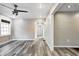 An empty living room with hardwood-style floors, ceiling fan, and neutral paint at 3549 N Sherman Dr, Indianapolis, IN 46218