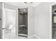 Bathroom featuring a glass shower with seating, a toilet, tile floors and soft gray paint at 4152 S Creekside Dr, New Palestine, IN 46163