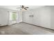 Spacious bedroom featuring neutral carpet, a ceiling fan and a large window with natural light at 4152 S Creekside Dr, New Palestine, IN 46163