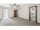 Bedroom featuring neutral carpet, a ceiling fan, an open closet and a large window with natural light at 4152 S Creekside Dr, New Palestine, IN 46163