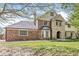 Inviting exterior elevation of a two-story home featuring a combination of brick, stone, and siding at 4152 S Creekside Dr, New Palestine, IN 46163