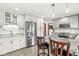 Modern kitchen with white cabinets, stainless steel appliances, and granite countertops at 4152 S Creekside Dr, New Palestine, IN 46163
