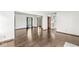 Open living room with hardwood floors connects to the foyer and a bright kitchen at 4152 S Creekside Dr, New Palestine, IN 46163