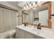 Updated bathroom with double sinks, large mirror, and shower/tub combo at 431 Fox Cir, Noblesville, IN 46060
