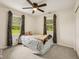 Bedroom with carpet flooring, ceiling fan and two windows at 431 Fox Cir, Noblesville, IN 46060