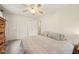 Bedroom with carpet flooring, ceiling fan and two closets at 431 Fox Cir, Noblesville, IN 46060