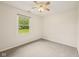 Empty bedroom with carpet flooring, a window and a ceiling fan at 431 Fox Cir, Noblesville, IN 46060