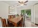 Cozy dining area with wooden table, chairs, and sliding glass doors to outdoor patio at 431 Fox Cir, Noblesville, IN 46060