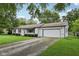 Inviting single-story home with white siding and a convenient attached two-car garage at 431 Fox Cir, Noblesville, IN 46060