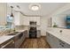Beautiful kitchen with a farmhouse sink, white cabinets, stainless appliances and luxury vinyl flooring at 431 Fox Cir, Noblesville, IN 46060