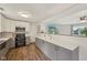 Bright kitchen featuring white cabinets, stainless appliances and luxury vinyl flooring at 431 Fox Cir, Noblesville, IN 46060