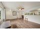 Spacious living room with laminate floors, an open layout, and access to the dining area at 431 Fox Cir, Noblesville, IN 46060