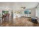 Open-concept living space featuring hardwood floors, modern ceiling fans, and abundant natural light at 431 Fox Cir, Noblesville, IN 46060